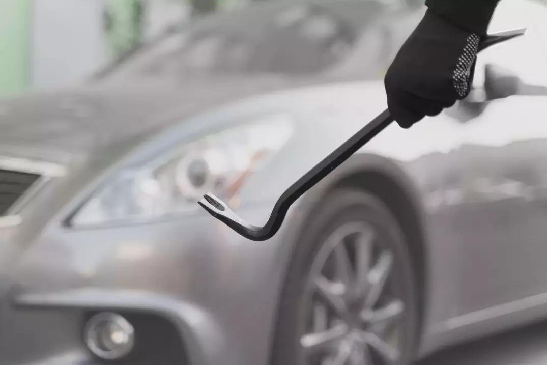 Dent Removal: Skilled technician repairing a car dent